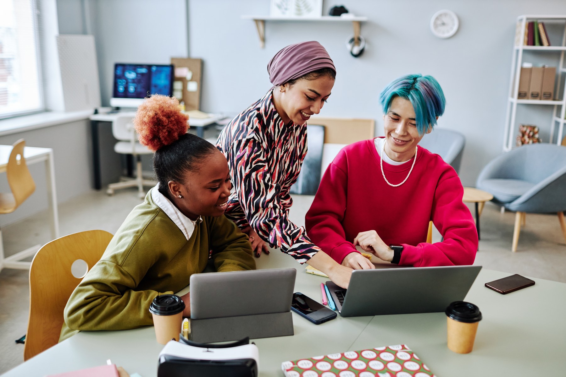 Design team reviewing a laptop together
